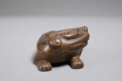 A Chinese bronze scroll or paper weight shaped as a Buddhist lion or Shishi, 18/19th C.