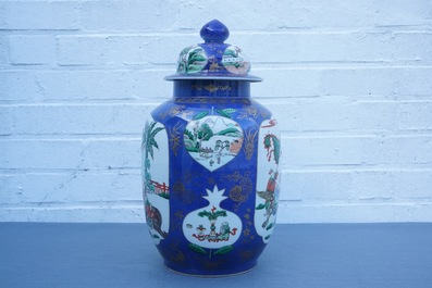 A Chinese famille verte on powder blue ground vase and cover, 19th C.
