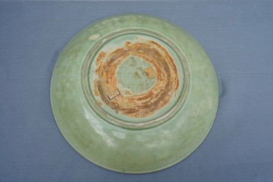A massive Chinese Longquan celadon dish with underglaze design, Ming