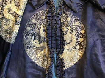 A blue-ground silk coat composed of Imperial Chinese gold thread dragon badges, 19th C.
