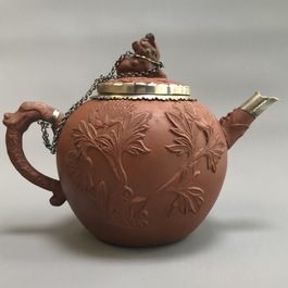 Two Chinese Yixing stoneware teapots with applied floral design, Kangxi
