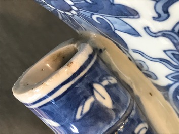 A Chinese blue and white lotus scroll hu vase, 19th C.