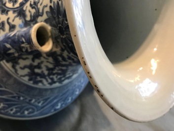 A Chinese blue and white lotus scroll hu vase, 19th C.