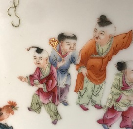 A Chinese famille rose plaque with boys in a landscape, Guangxu mark, Republic, 1st half 20th C.