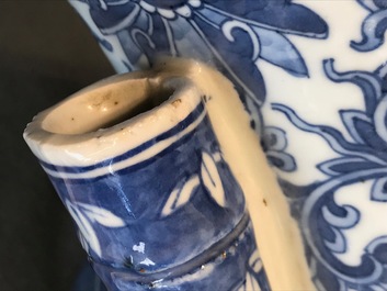 A Chinese blue and white lotus scroll hu vase, 19th C.