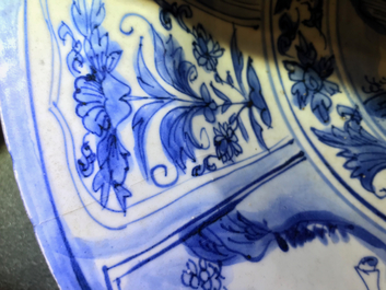 A Chinese blue and white dish with figures in a landscape, Transitional period