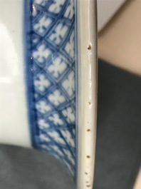 A pair of Chinese blue and white vases with ladies at a table, 19th C.