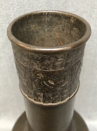 A Chinese bottle-shaped bronze vase with applied design, Yuan