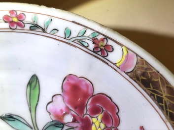 A reticulated double-walled Chinese famille rose cup and saucer, Yongzheng