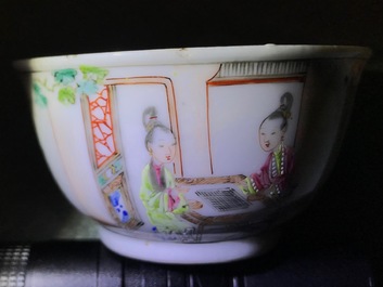 A pair of fine Chinese famille rose cups and saucers with figures in a garden, Yongzheng/Qianlong