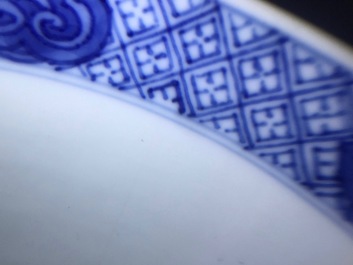 A Chinese blue and white bowl with figurative design all around, Kangxi/Yongzheng