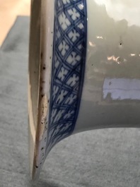 A pair of Chinese blue and white vases with ladies at a table, 19th C.