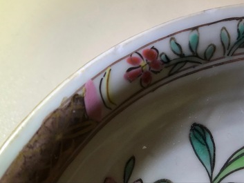 A reticulated double-walled Chinese famille rose cup and saucer, Yongzheng