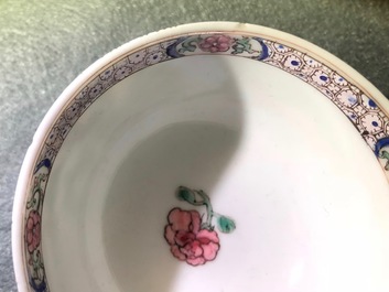 A Chinese famille rose cup and saucer depicting Lie Ti Guai with three goats, Yongzheng