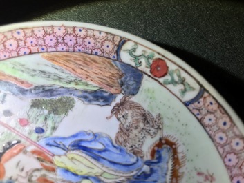 A Chinese famille rose cup and saucer depicting Lie Ti Guai with three goats, Yongzheng