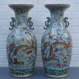 A pair of Chinese famille rose celadon-ground dragon vases, 19th C.