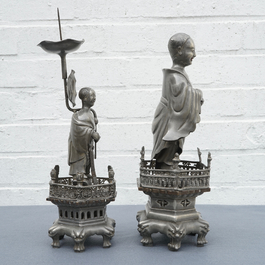 A Chinese pewter candlestick and a figure of a boy, 19/20th C.