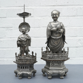 A Chinese pewter candlestick and a figure of a boy, 19/20th C.