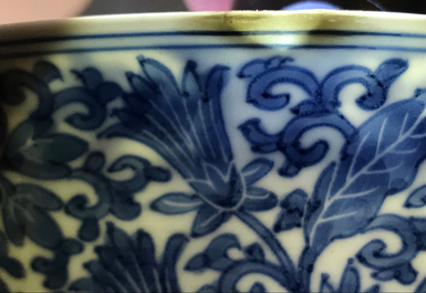 A Chinese blue and white bowl with floral design, Kangxi mark and of the period