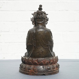 A Chinese bronze figure of Guanyin seated on a lotus throne, Ming