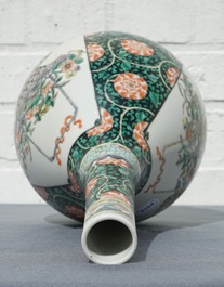 A Chinese famille verte bottle vase with fine flower baskets, 19th C.
