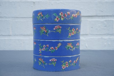 A Chinese blue-ground famille rose four-tier box, Tongzhi mark, 19th C.
