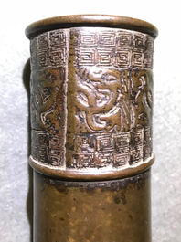 A Chinese bottle-shaped bronze vase with applied design, Yuan