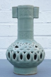 A Chinese celadon-glazed reticulated double-walled vase, 19/20th C.