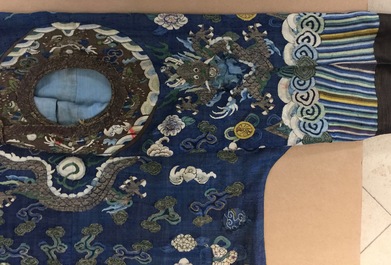 A Chinese blue-ground kesi eight-dragon robe, 19th C.