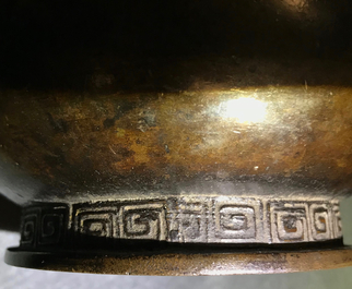 Een Chinese bronzen flesvormige vaas met reli&euml;fdecor, Yuan