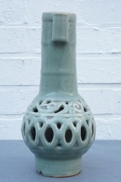A Chinese celadon-glazed reticulated double-walled vase, 19/20th C.