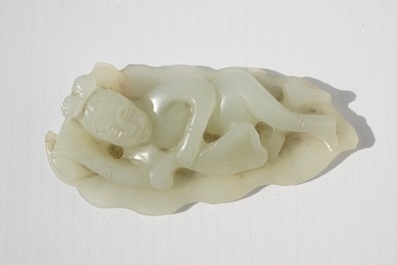 A Chinese celadon jade model of a reclining lady on lotus leaf, Qing