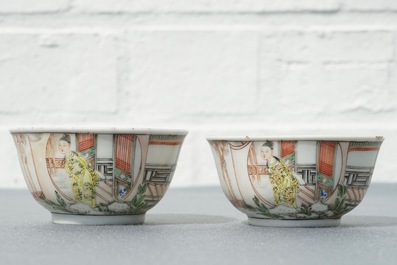 A pair of fine Chinese famille rose cups and saucers with figures in a garden, Yongzheng/Qianlong