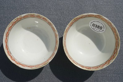 A pair of fine Chinese famille rose cups and saucers with figures in a garden, Yongzheng/Qianlong