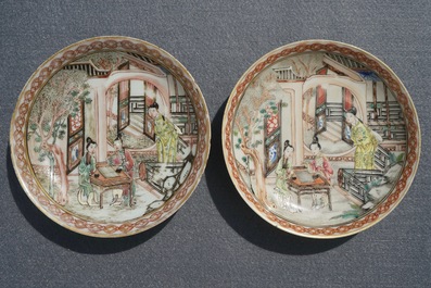 A pair of fine Chinese famille rose cups and saucers with figures in a garden, Yongzheng/Qianlong