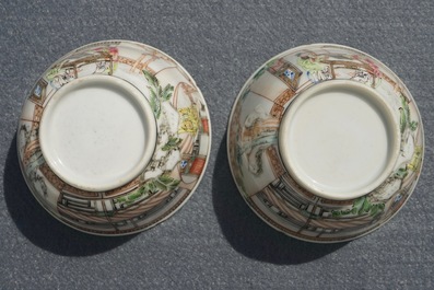 A pair of fine Chinese famille rose cups and saucers with figures in a garden, Yongzheng/Qianlong