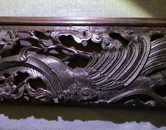 A Chinese carved wood frame depicting mythical beasts, 19th C.