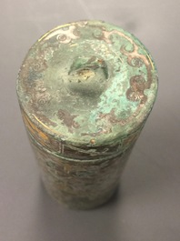 A Chinese gilt and silvered bronze seal or scroll weight, Han or later