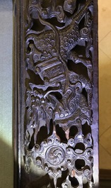 A Chinese carved wood frame depicting mythical beasts, 19th C.