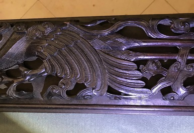 A Chinese carved wood frame depicting mythical beasts, 19th C.