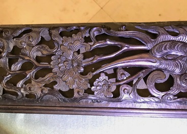 A Chinese carved wood frame depicting mythical beasts, 19th C.