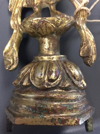 A Chinese gilt bronze figure of Guanyin, Tang or later