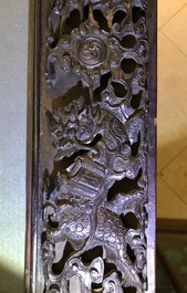 A Chinese carved wood frame depicting mythical beasts, 19th C.