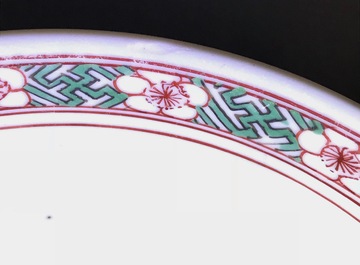 A Chinese wucai bowl with boys holding lotus flowers, Transitional period