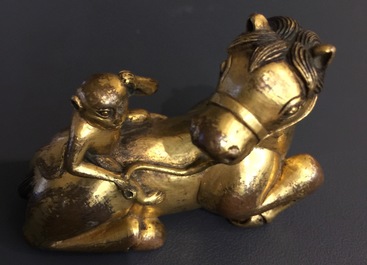 An inscribed Chinese gilt bronze model of a monkey on a horse, 19/20th C.