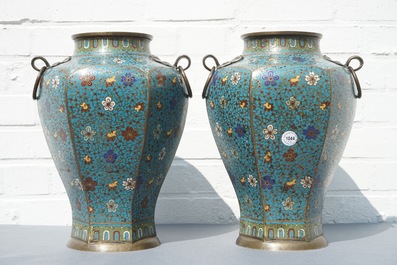 A pair of Chinese cloisonn&eacute; vases with floral design and ring handles, 19th C.