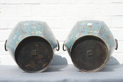 A pair of Chinese cloisonn&eacute; vases with floral design and ring handles, 19th C.