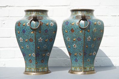 A pair of Chinese cloisonn&eacute; vases with floral design and ring handles, 19th C.