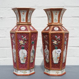 A pair of reticulated double-walled hexagonal Chinese famille rose vases, Yongzheng