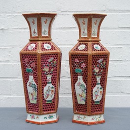 A pair of reticulated double-walled hexagonal Chinese famille rose vases, Yongzheng